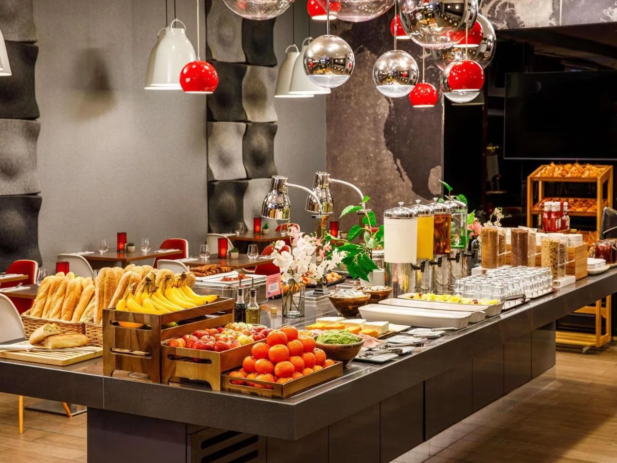 a buffet line with many different types of food at ibis London Blackfriars in London